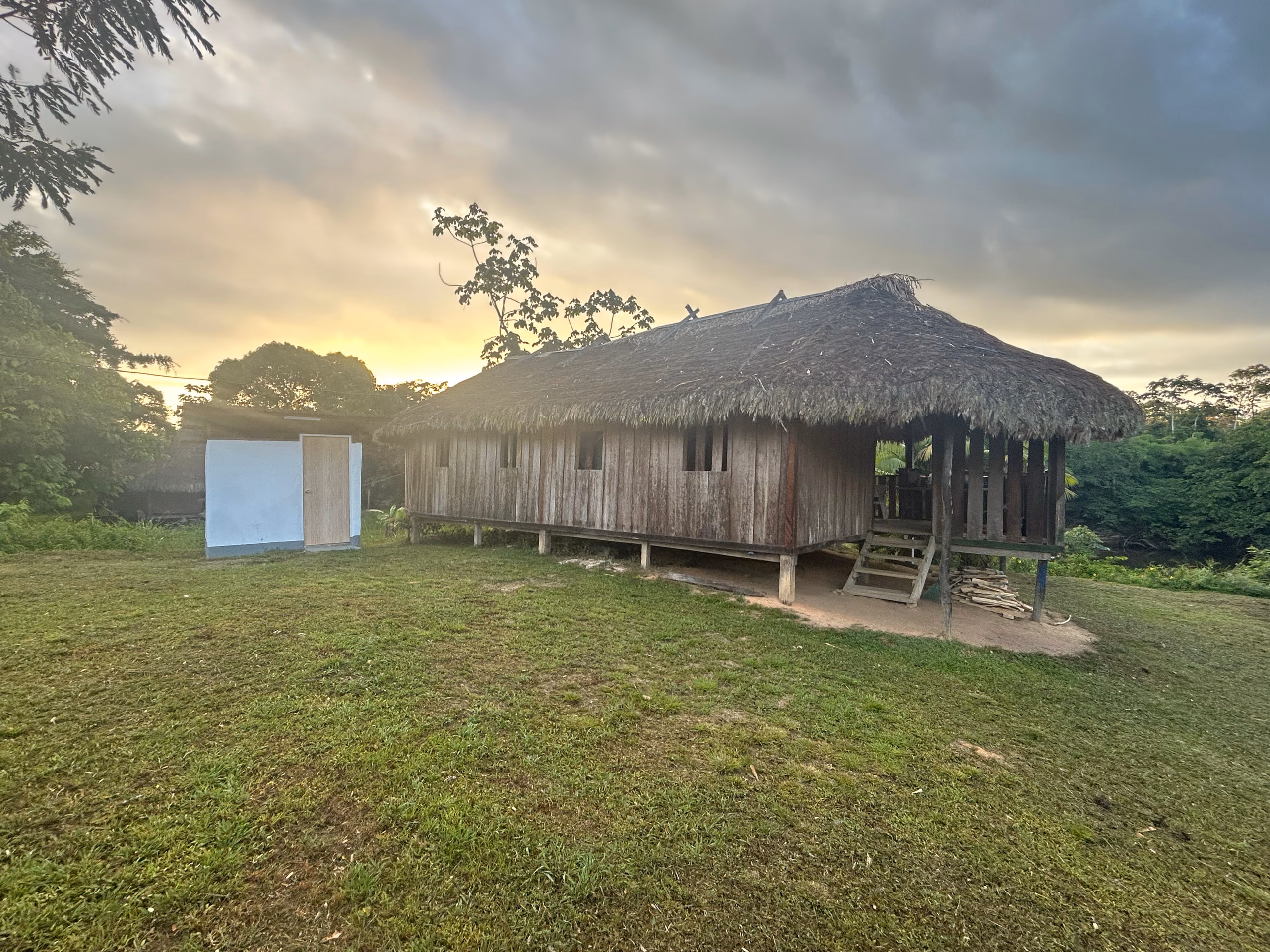 The community-owned guesthouse at Kwamalasamutu at dusk
